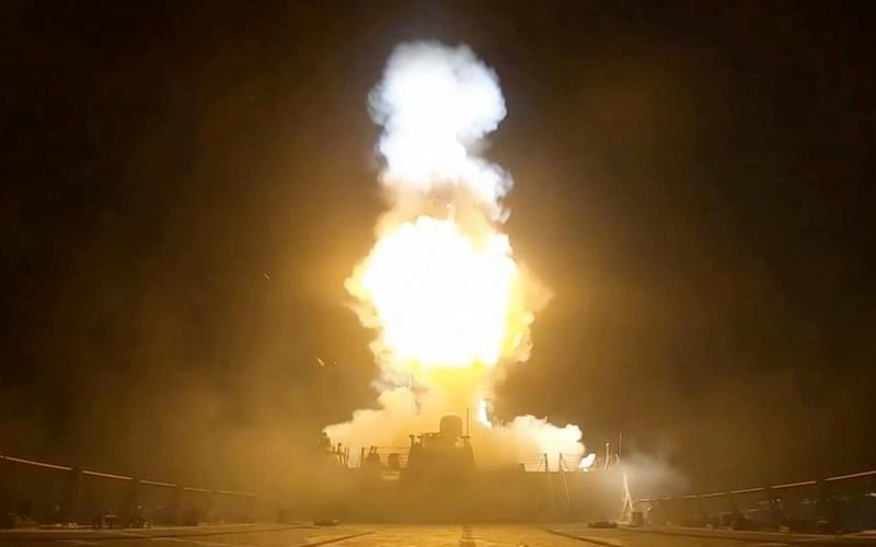 Smoke billows after military strikes during escalating US-Iran tensions near the Strait of Hormuz.