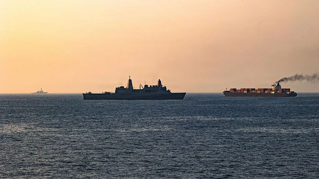 Smoke rises after US airstrikes targeting IRGC facilities in Iran.