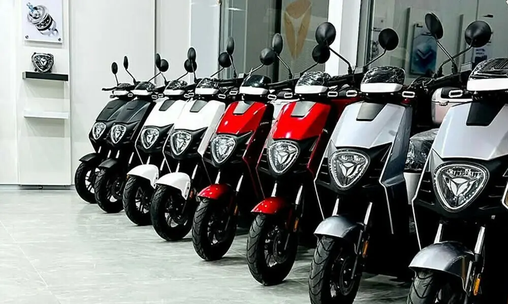 Electric motorcycles displayed at a dealership in Karachi's Akbar Road market.