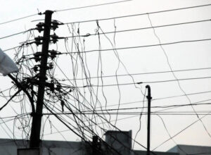 Employees work during a power outage at a Sindh education office in Karachi.