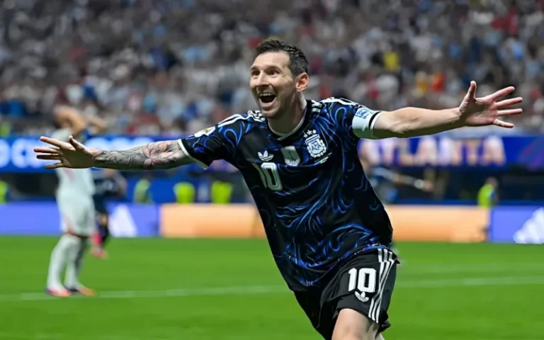 Lionel Messi celebrates as Argentina defeats England to reach the FIFA World Cup final.