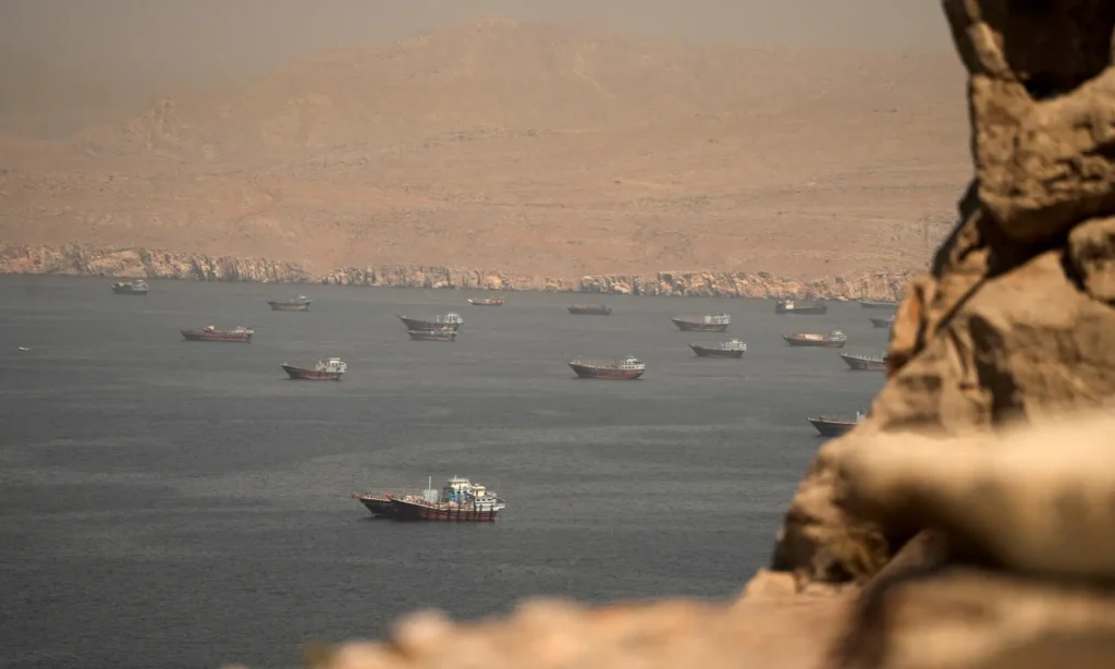 Oil tankers transit the Strait of Hormuz as tensions escalate between Iran and the United States.