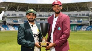 Pakistan captain Babar Azam and West Indies captain Roston Chase pose with the Test series trophy before the opening match in Trinidad.