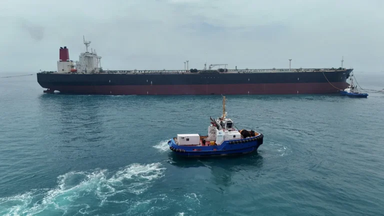 An oil tanker sails through the Strait of Hormuz as global oil prices climb amid rising US-Iran tensions.