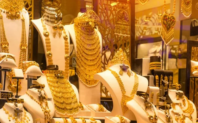 Gold bars and jewellery displayed as gold prices increase in Pakistan.