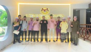 Malaysian students and consulate officials attend a community engagement event in Karachi.