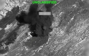 Smoke billows following military strikes as tensions escalate between Iran and the United States in the Middle East.