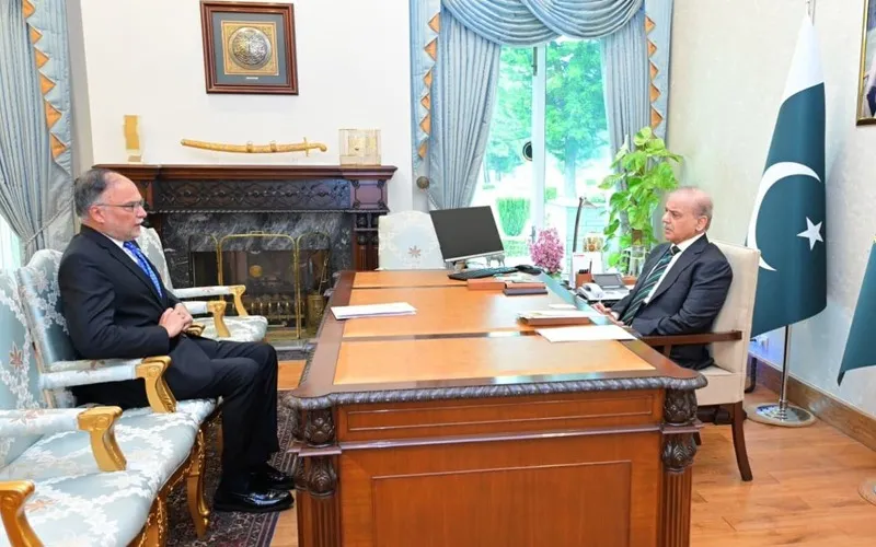 Prime Minister Shehbaz Sharif meets Planning Minister Ahsan Iqbal to review PSDP development projects in Islamabad.