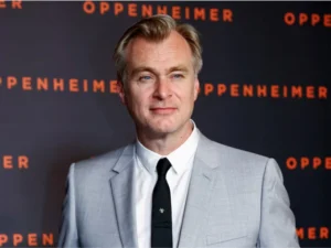 Christopher Nolan on a film set as cast members discuss his strict production rules during the filming of The Odyssey.