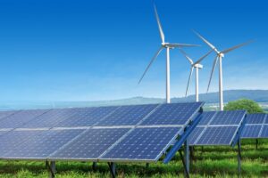 Wind turbines and solar panels at a renewable energy project approved by NEPRA near Karachi.
