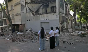 Rescue workers assess damage after a powerful earthquake in Colombia