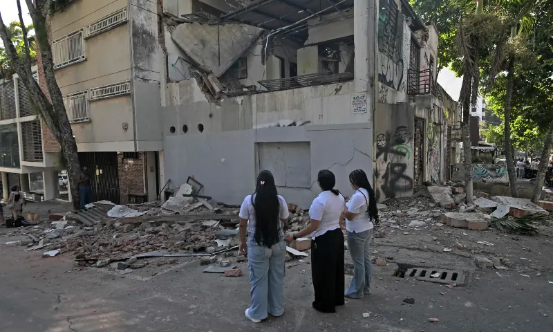 Rescue workers assess damage after a powerful earthquake in Colombia