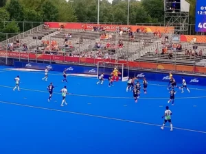 Pakistan and India hockey players competing in a decisive Hockey World Cup Group D match