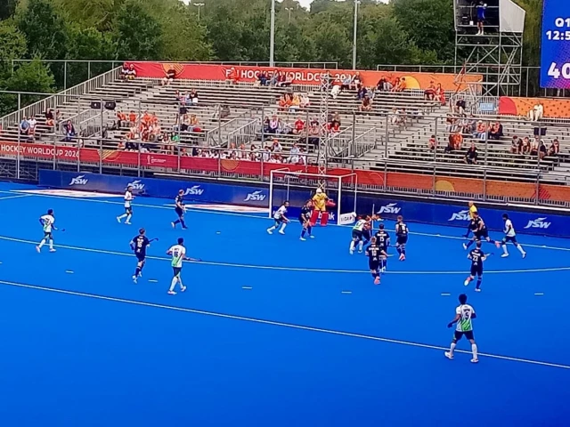 Pakistan and India hockey players competing in a decisive Hockey World Cup Group D match
