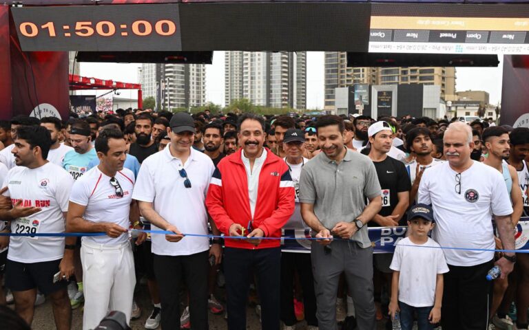 Thousands of participants run along Karachi's Sea View during Shahada Run 2026 organised by Sindh Police to honour fallen officers.