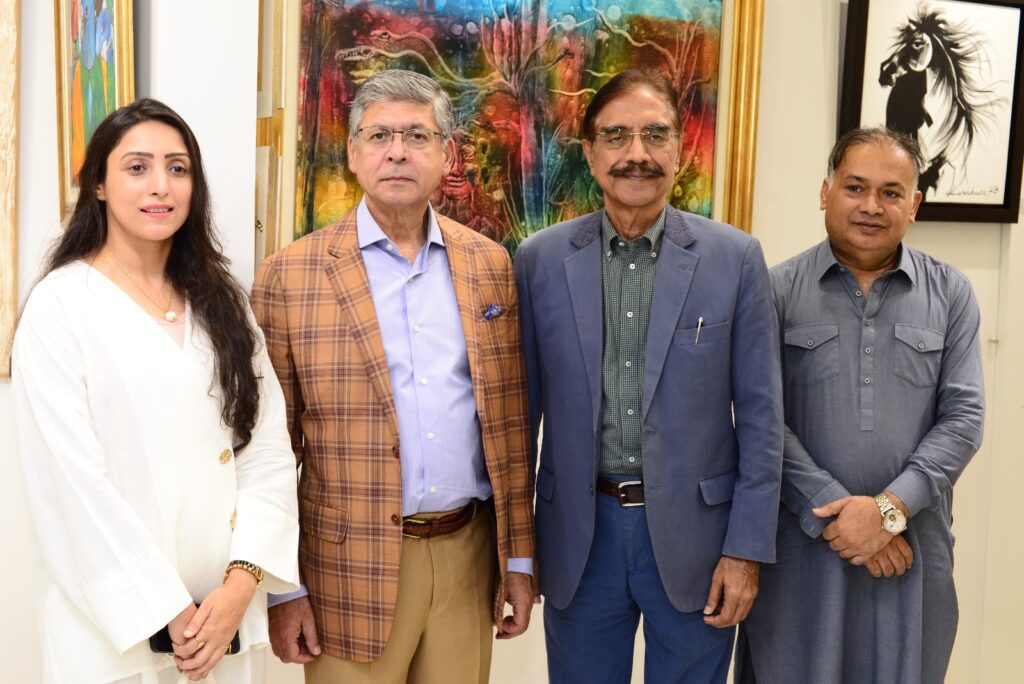 Guests viewing paintings at the “An Ode to the Masters” art exhibition at Studio Sarai.