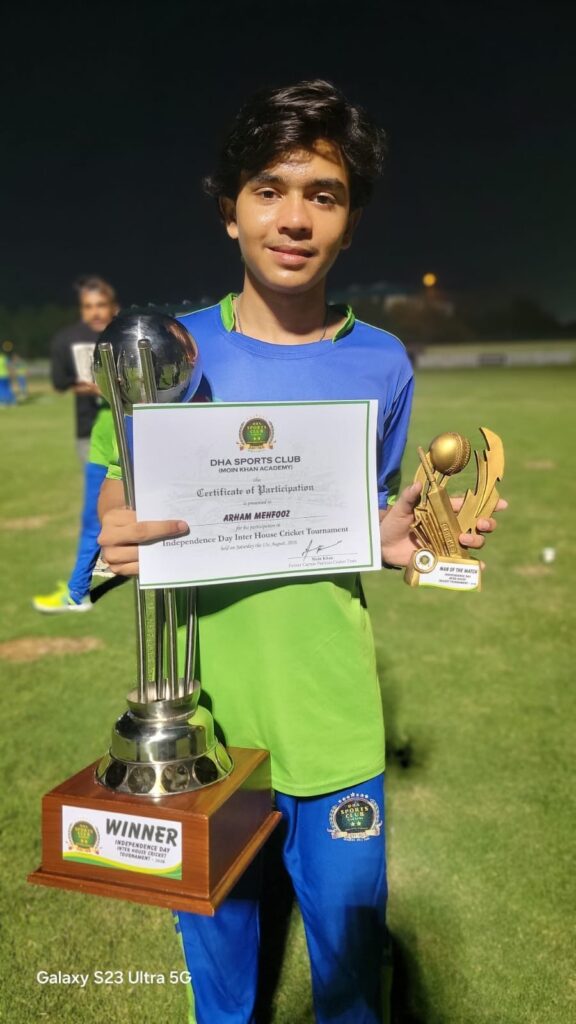 Arham Mehfooz celebrates his Man of the Match award after an all-round cricket performance in Karachi.