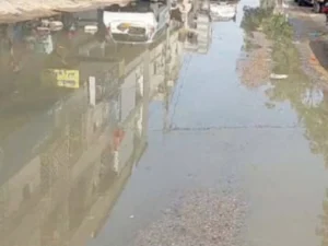 Flooded road caused by overflowing sewerage in Gulshan-e-Iqbal, Karachi.