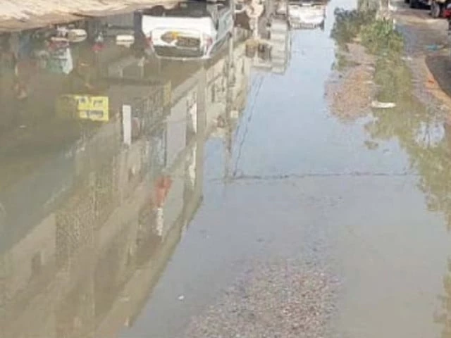 Flooded road caused by overflowing sewerage in Gulshan-e-Iqbal, Karachi.