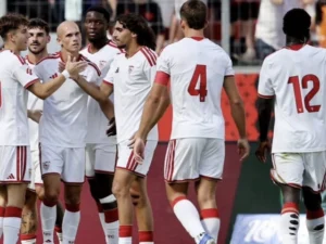 Sevilla players celebrate their 2-1 comeback win over Rayo Vallecano in LaLiga.