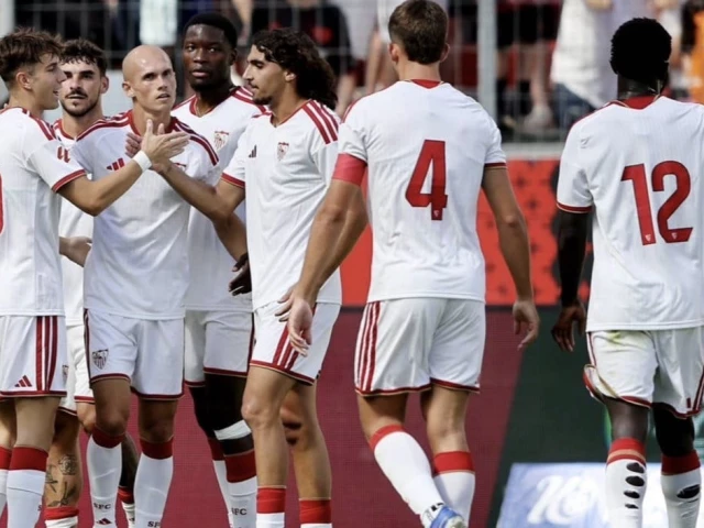 Sevilla players celebrate their 2-1 comeback win over Rayo Vallecano in LaLiga.