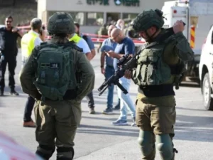 Israeli military vehicles leave the Qalandia refugee camp following a two-day operation.