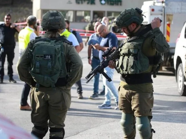 Israeli military vehicles leave the Qalandia refugee camp following a two-day operation.