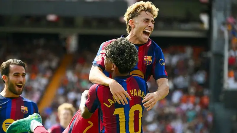 Barcelona players celebrate during their 5-0 win over Valencia in La Liga