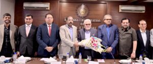 KATI President Muhammad Ikram Rajput presents bouquet to BMG Chairman Zubair Motiwala