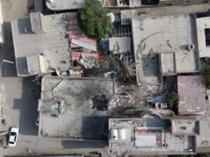 Damaged building in Kuhestak after a deadly strike during a wedding gathering in southern Iran.