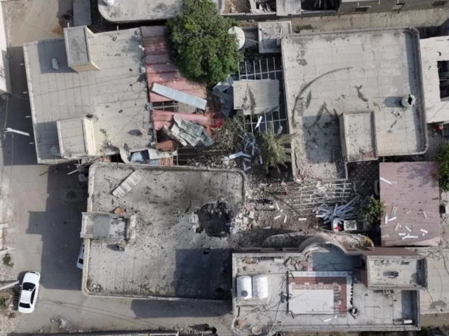 Damaged building in Kuhestak after a deadly strike during a wedding gathering in southern Iran.