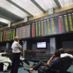 Pakistan Stock Exchange market update showing the KSE-100 Index at 166,130.38 points during trading on October 20, 2026