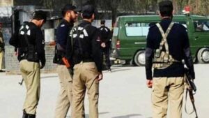 Police personnel at the scene of an attack in Karak where two policemen were martyred