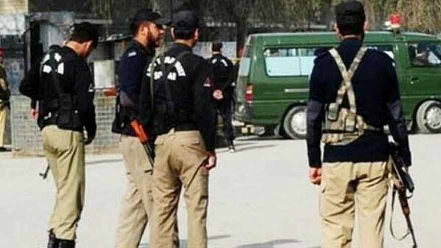 Police personnel at the scene of an attack in Karak where two policemen were martyred