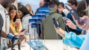 1. Apple iPhone Duo foldable smartphone displayed in a retail store.