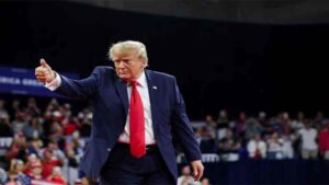 Donald Trump speaks at a Michigan campaign rally amid controversy over Senate candidate Abdul El-Sayed.