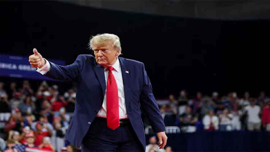 Donald Trump speaks at a Michigan campaign rally amid controversy over Senate candidate Abdul El-Sayed.