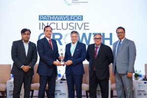- Khushhali Microfinance Bank representatives celebrate the bank’s two awards at the PMN Annual Microfinance Conference.