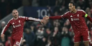 1. Liverpool players celebrate after scoring during their Champions League match against Villarreal.